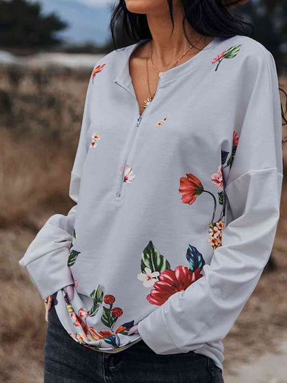 Blusa con cremallera delantera y hombros caídos con estampado floral