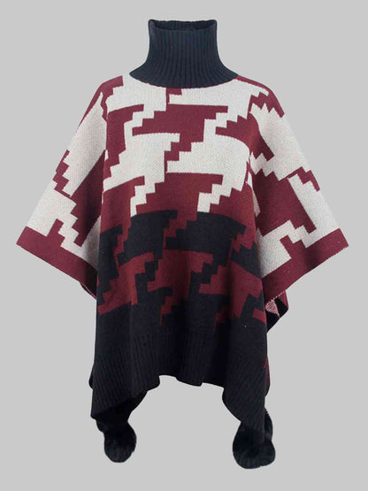 Poncho à col roulé et bordure à pompons