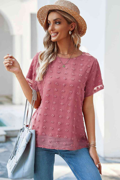 Blusa con cuello redondo y lunares suizos