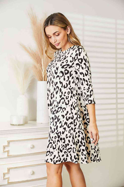 Celeste Vestido de manga tres cuartos de leopardo de tamaño completo con bolsillos