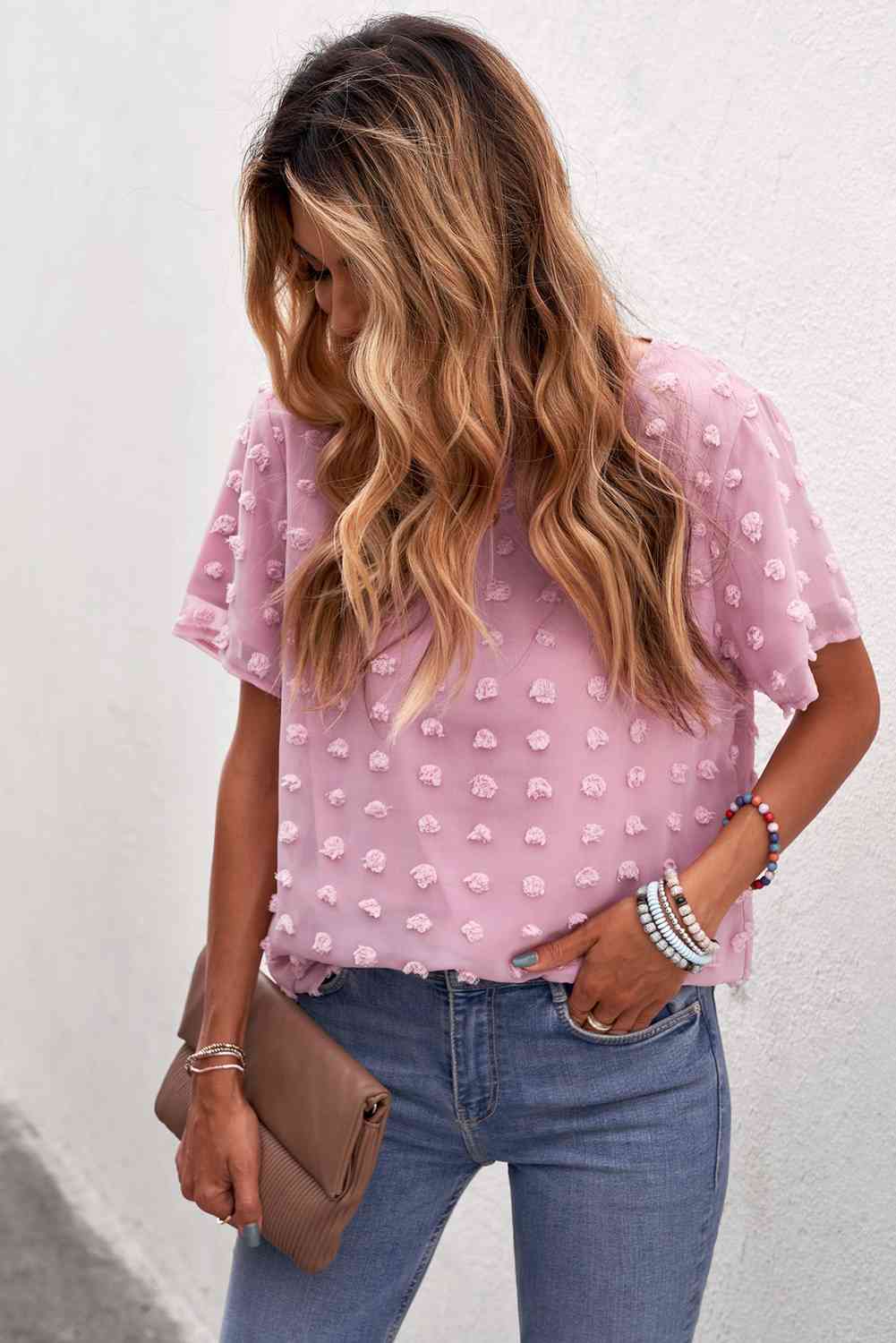 Blusa con cuello redondo y lunares suizos