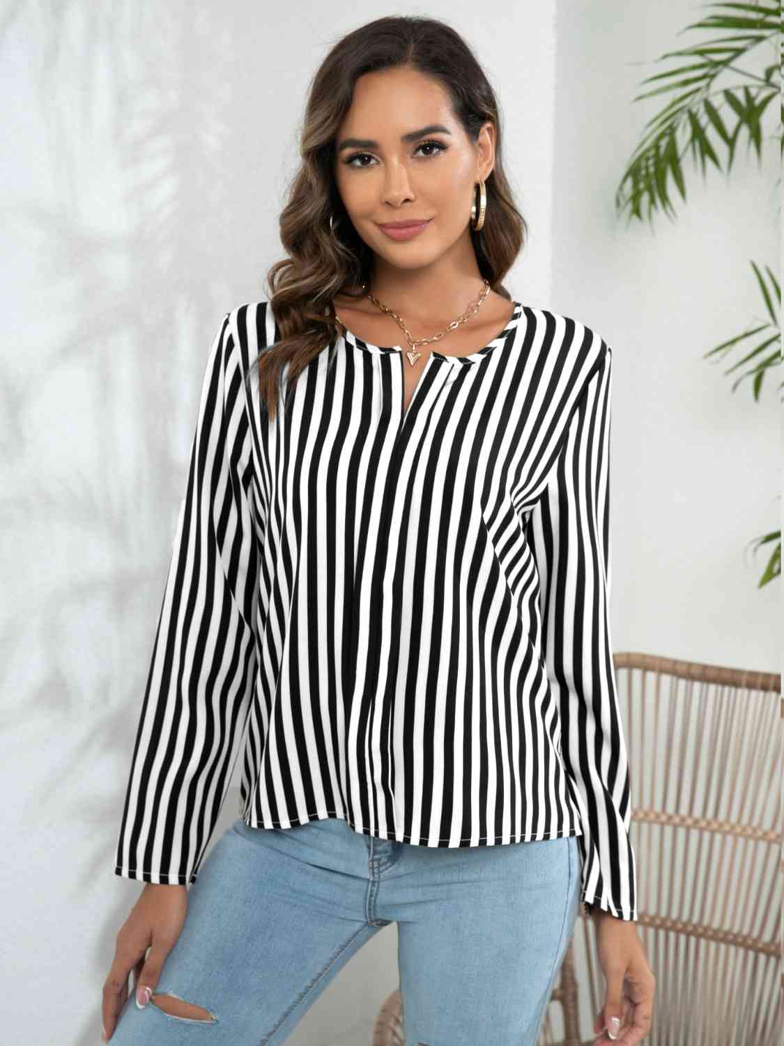 Blouse crantée à manches longues rayée