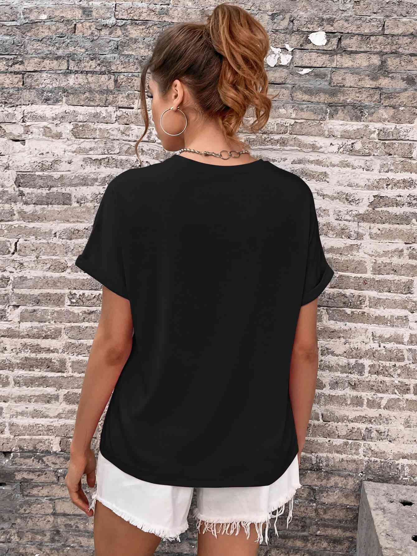 Camiseta con cuello redondo y manga con puños