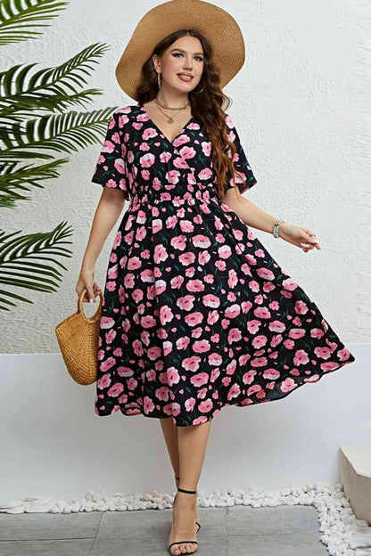 Vestido midi con sobrepelliz floral