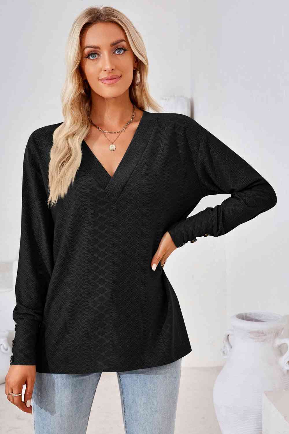 Blusa de manga larga con cuello en V