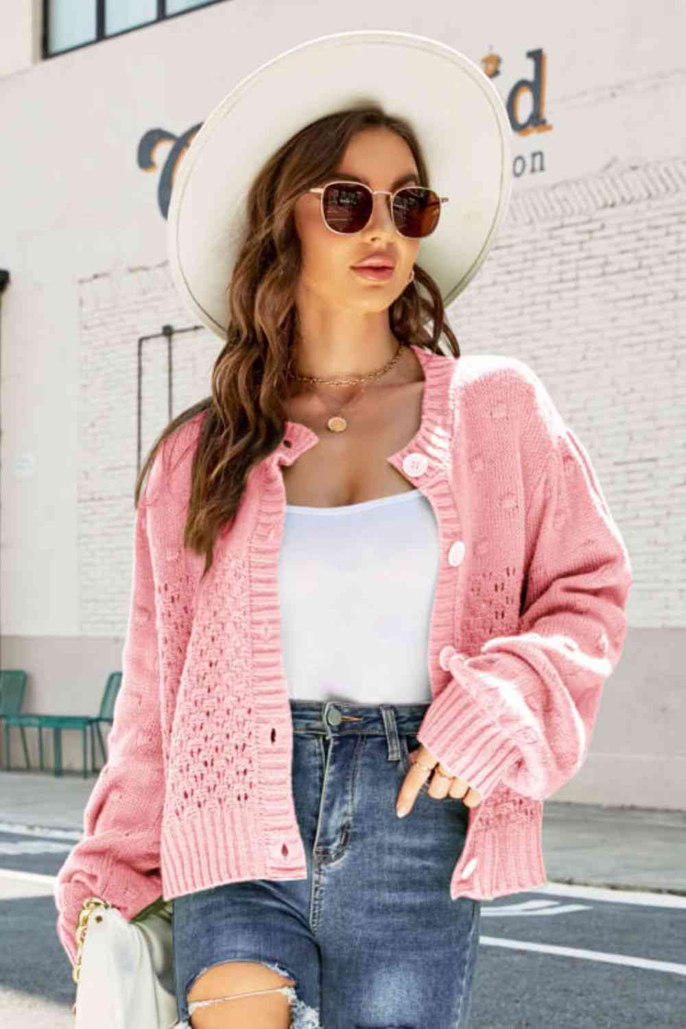 Cardigan tissé à manches bouffantes et pompon ajouré à droite