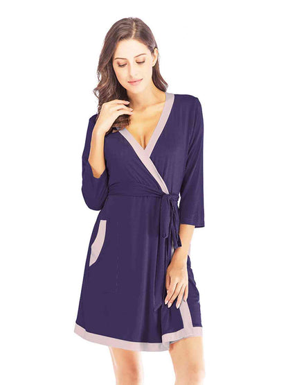 Robe à col surplis et poches à nouer à la taille