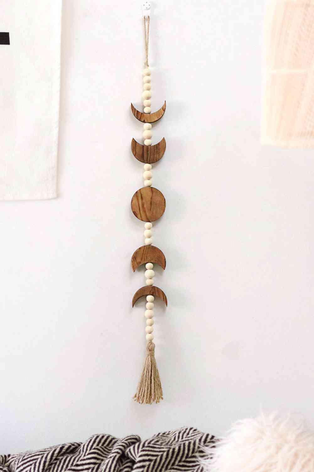 Colgante de pared con borlas de madera