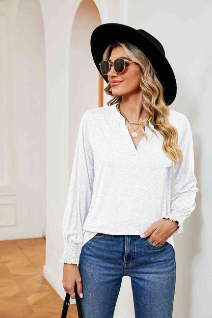 Blusa de manga larga con cuello con muescas